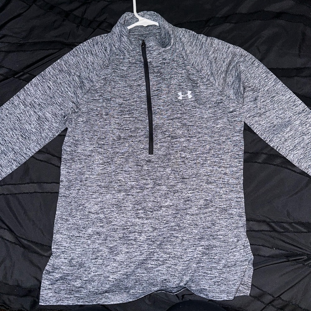 It is a light under armour jacket, and it zips up halfway